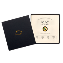 The May First Pendant inside its box