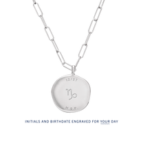 The back of a Birthdate Pendant with sample engraving. Initials and birthdate can be custom engraved for your day.