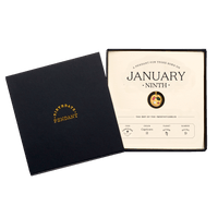 The January Ninth Pendant inside its box